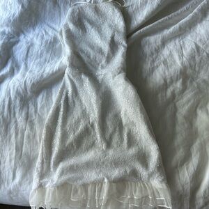 sequence dress in size xs! With a open tie back and ruffles on the bottom.